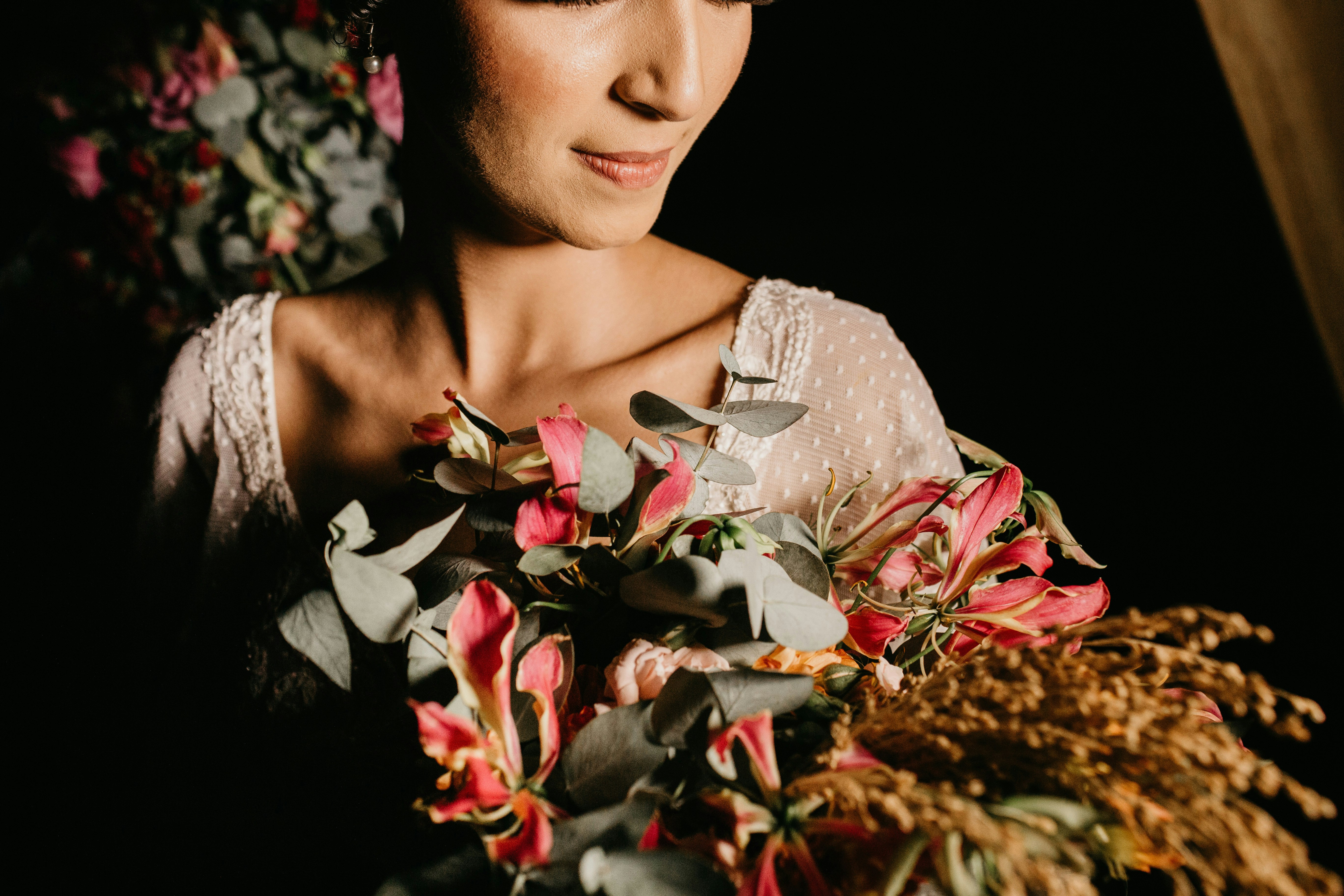 woman in white and red floral dress